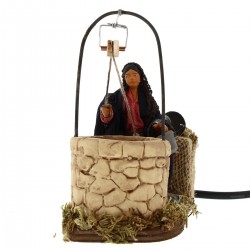 Moving Woman at the well in dressed terracotta 10 cm