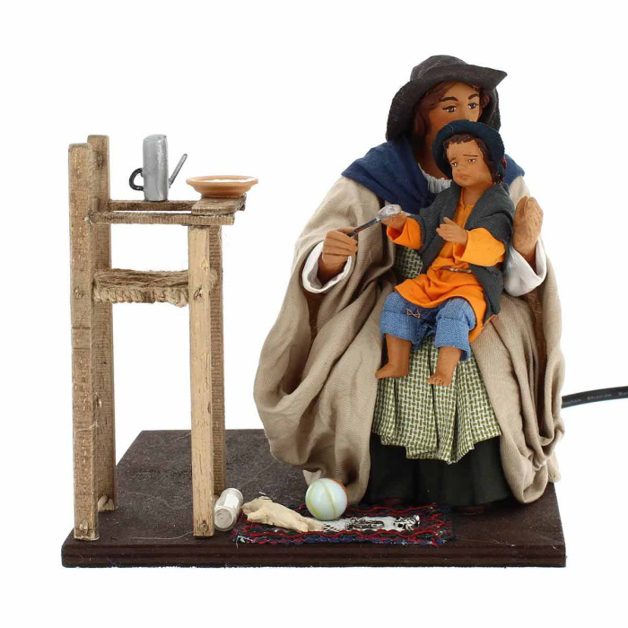Moving mother feeding child in dressed terracotta 24 cm