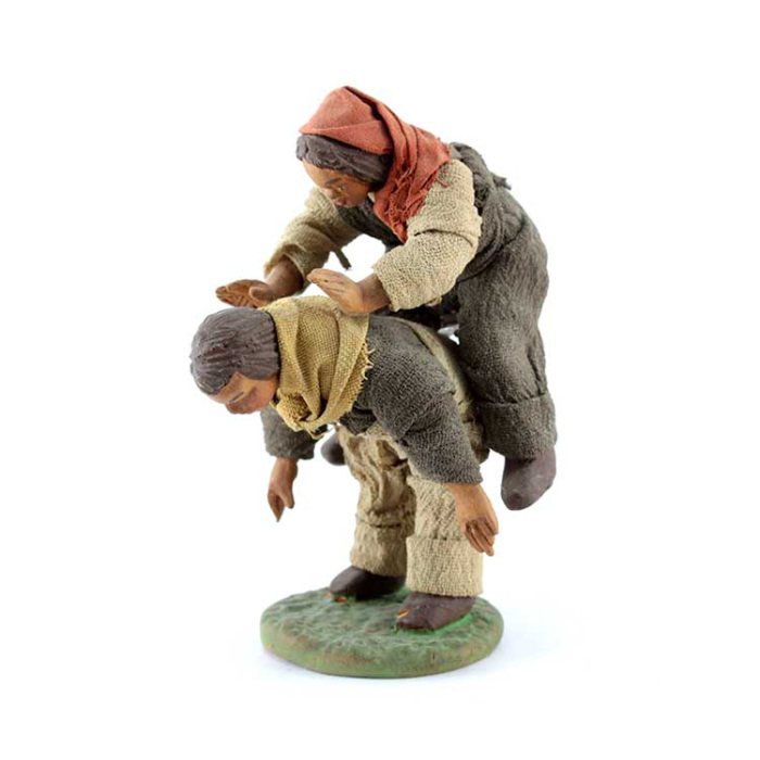 Fanciulli che giocano in terracotta vestita 10 cm