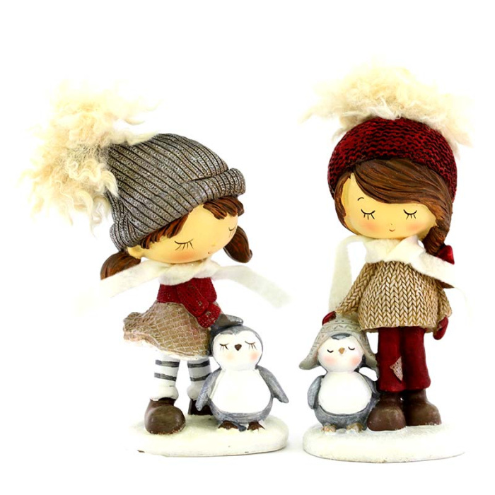 Bimba con cappello e pinguino in resina 15 cm