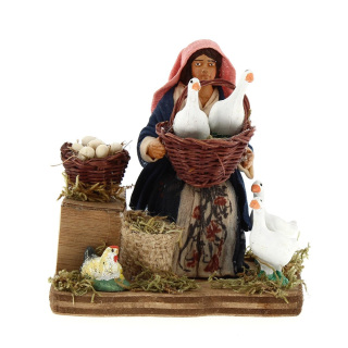 Woman sitting with geese basket in dressed terracotta 10 cm