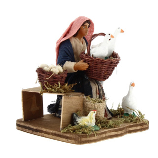 Woman sitting with geese basket in dressed terracotta 10 cm