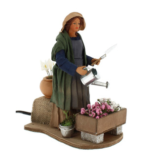 Mujer regando de terracota vestida en movimiento 24 cm