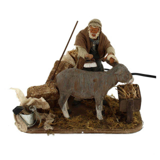Hombre acicalando burro de terracota vestida en movimiento 15 cm
