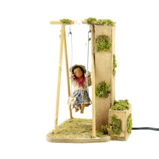 Bambino su altalena in terracotta vestita a movimento 24 cm