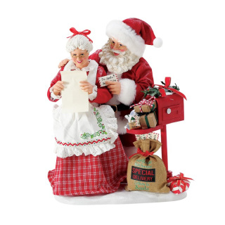 Papá Noel y la Señora Claus Abriendo Cartas 26,5 cm Dept. 56 6017705